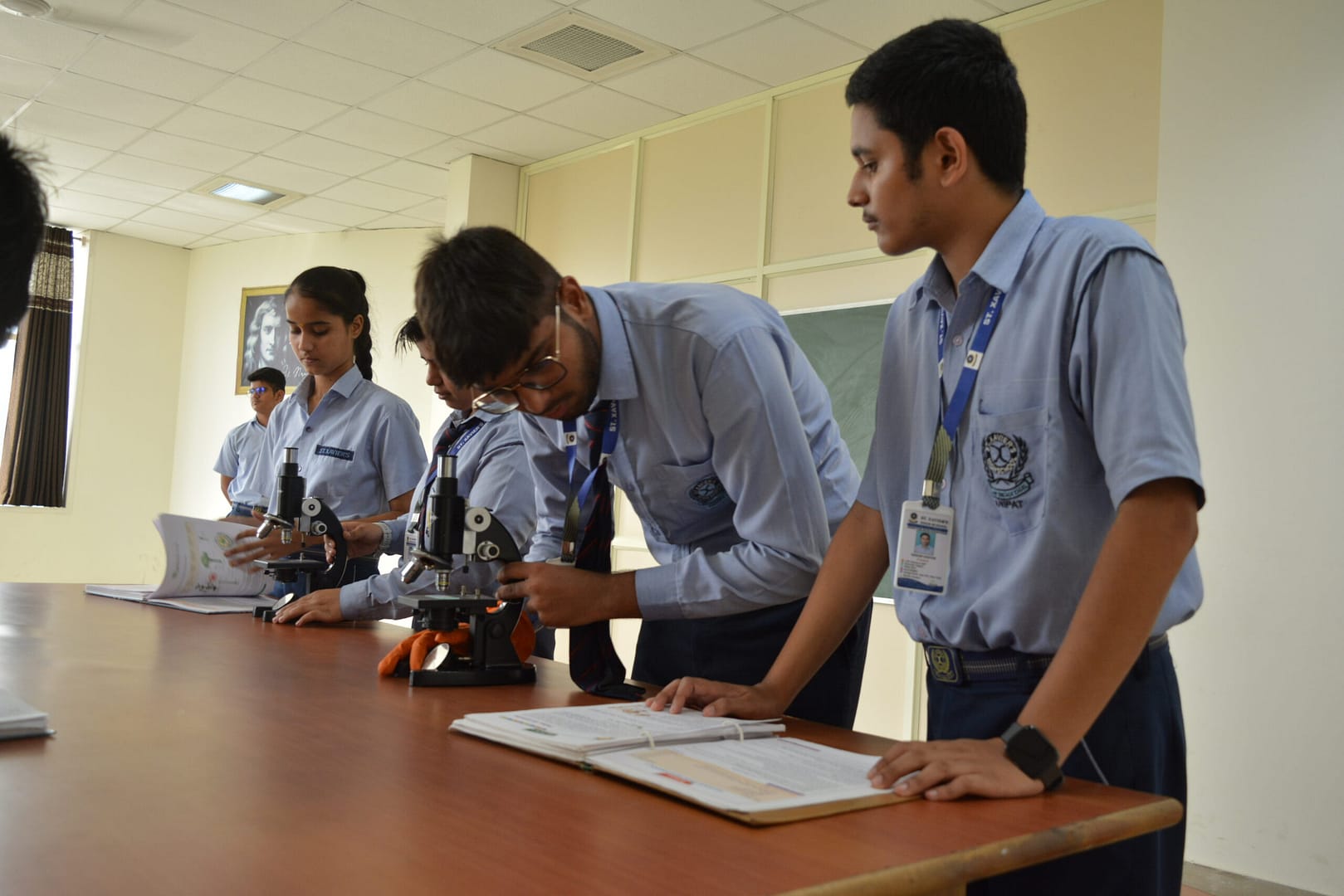 Students at SXHS using microscope
